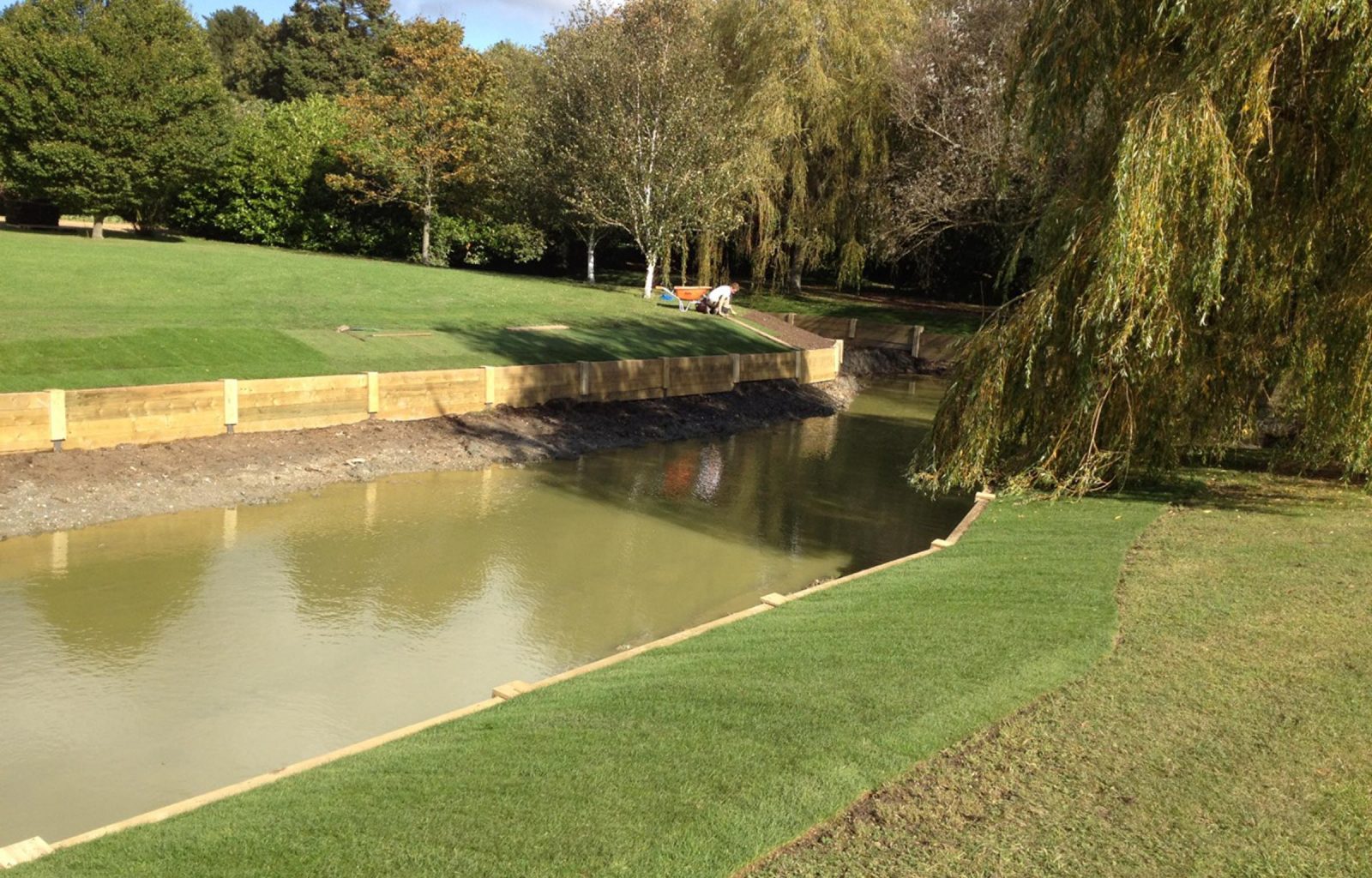 River landscaping with revetments and bridge Roger Gladwell Landscape
