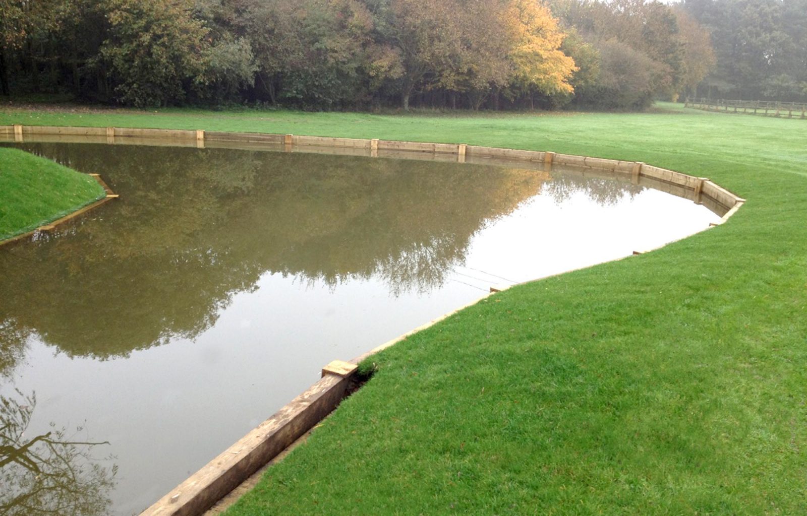 landscaping with revetments and timber bridge